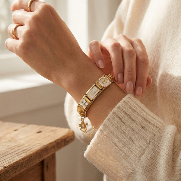 Gold 9mm Italian charm accent chain on bracelet with floral details, on wrist against a neutral background.
