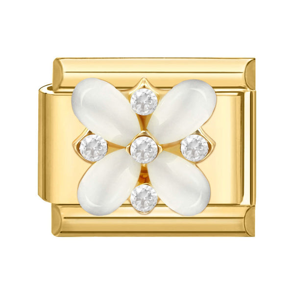 Gold charm with white floral design and clear crystals on a white background