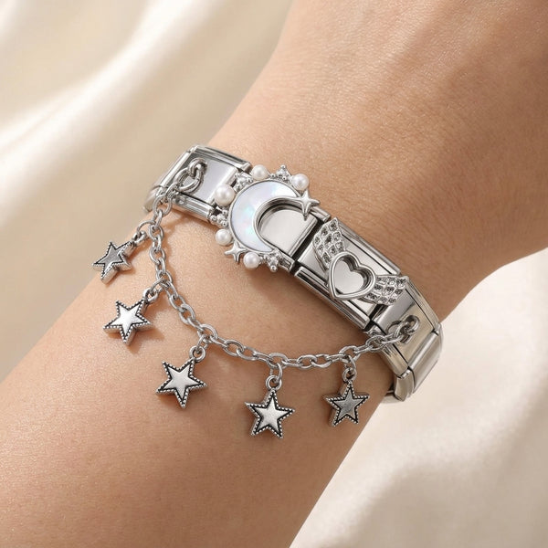 Silver 9mm Italian charm accent chain bracelet with star charms on a wrist against a neutral background