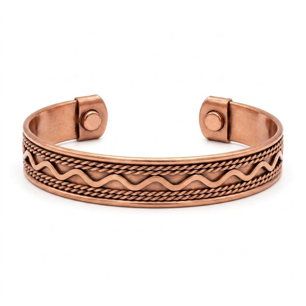 Copper bracelet with wave pattern on a white background