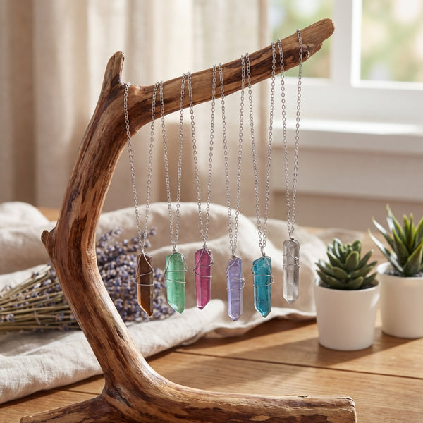 Colorful Crystal Pilar Necklaces Hanging On Wooden Display
