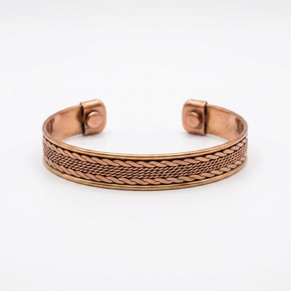 Copper bracelet with braided mesh design on a white background