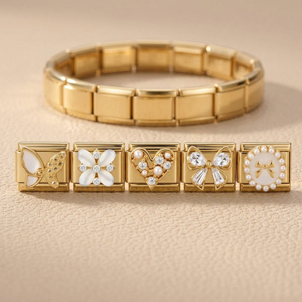 Gold bracelet with decorative Italian charms on a beige leather background